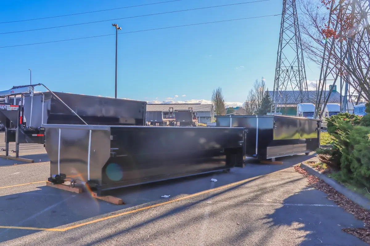 Roll-off dumpster ready for waste disposal at job site for Concrete Dumpster Rental in Polk